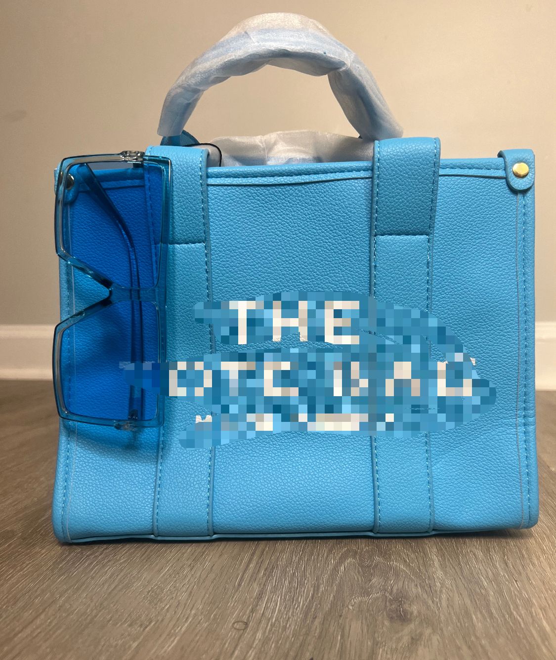 The Tote Bag Marc Jacobs with aqua blue shades